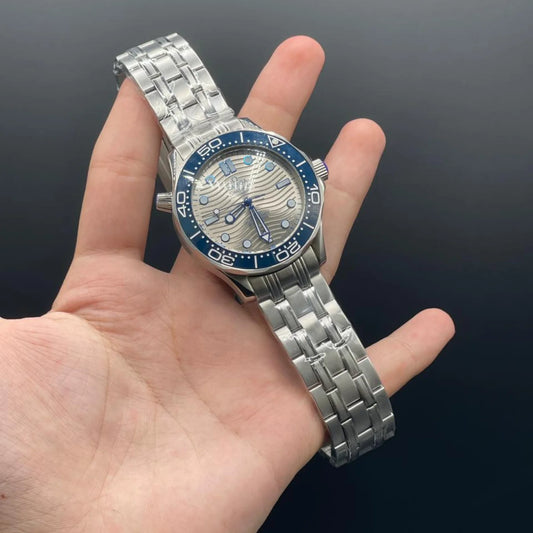 OM Silver Chain With Gray Dial And Blue Rotatable Bezel Automatic Watch