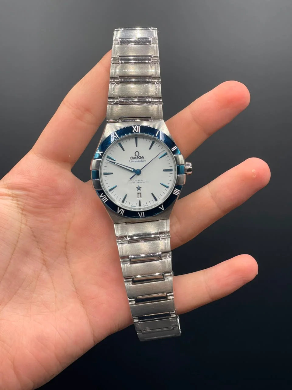 OM Silver Chain With White Dial And Blue Bezel Automatic Watch