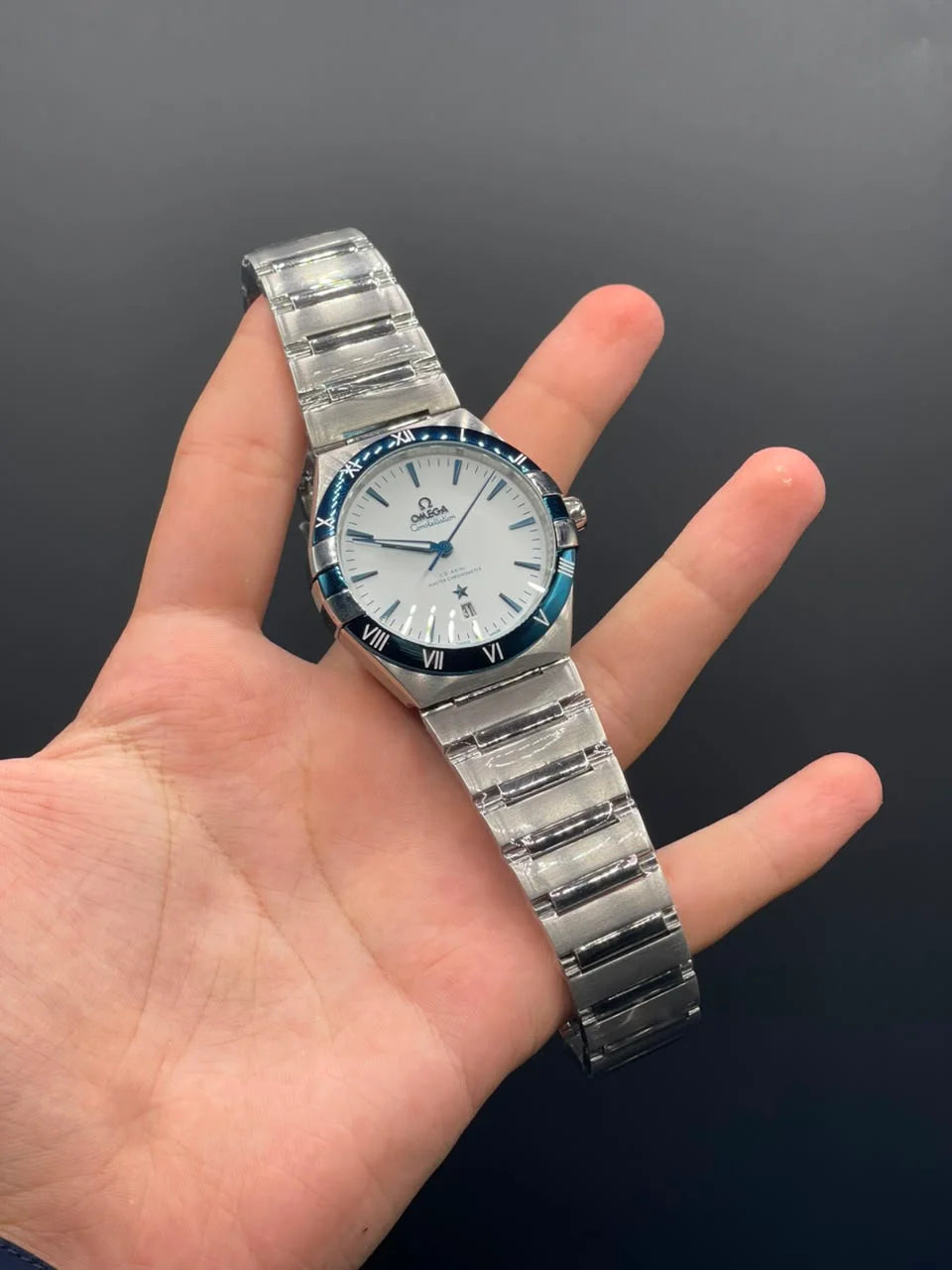 OM Silver Chain With White Dial And Blue Bezel Automatic Watch