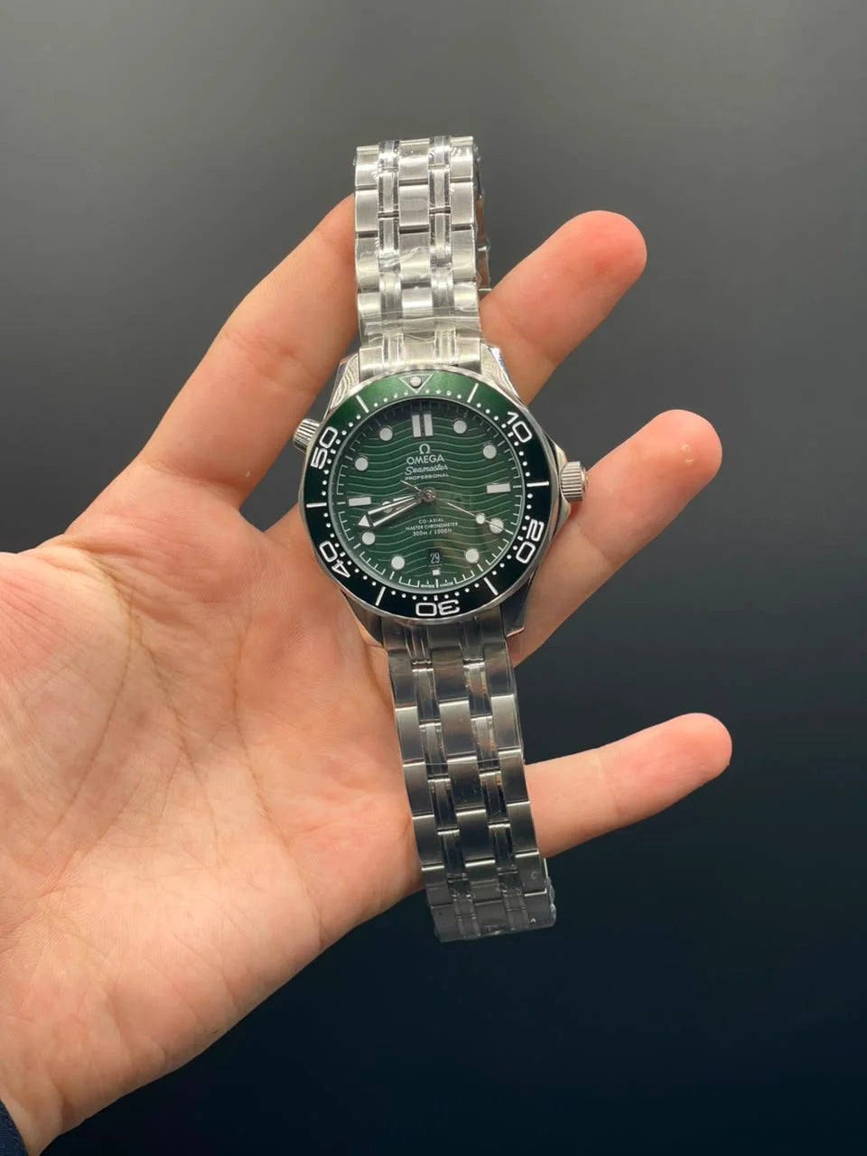 OM Silver Chain With Green Dial And Rotatable Bezel Automatic Watch