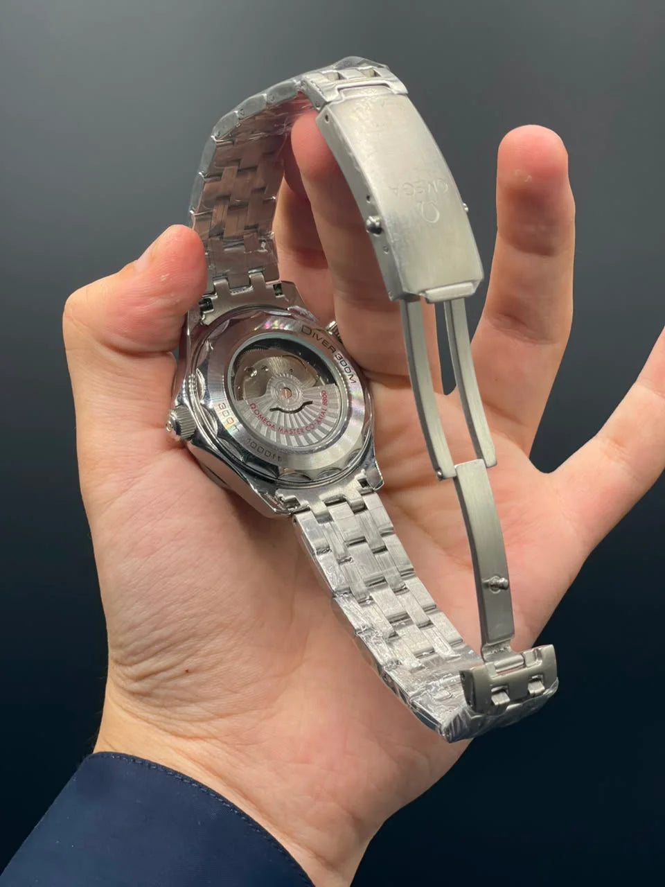 OM Silver Chain With Green Dial And Rotatable Bezel Automatic Watch