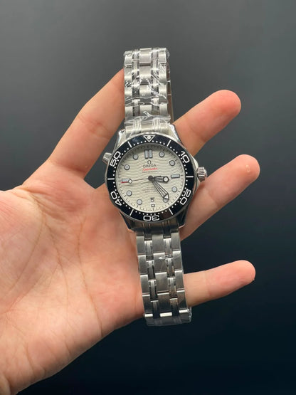 OM Silver Chain With White Dial And Black Bezel Automatic Watch